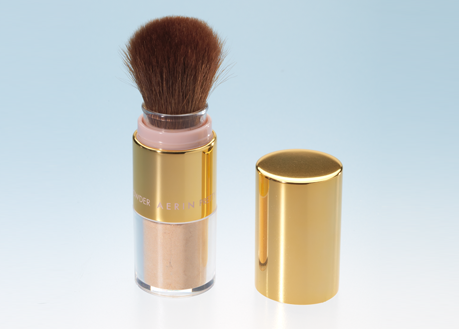 powder makeup dispenser with brush in gold